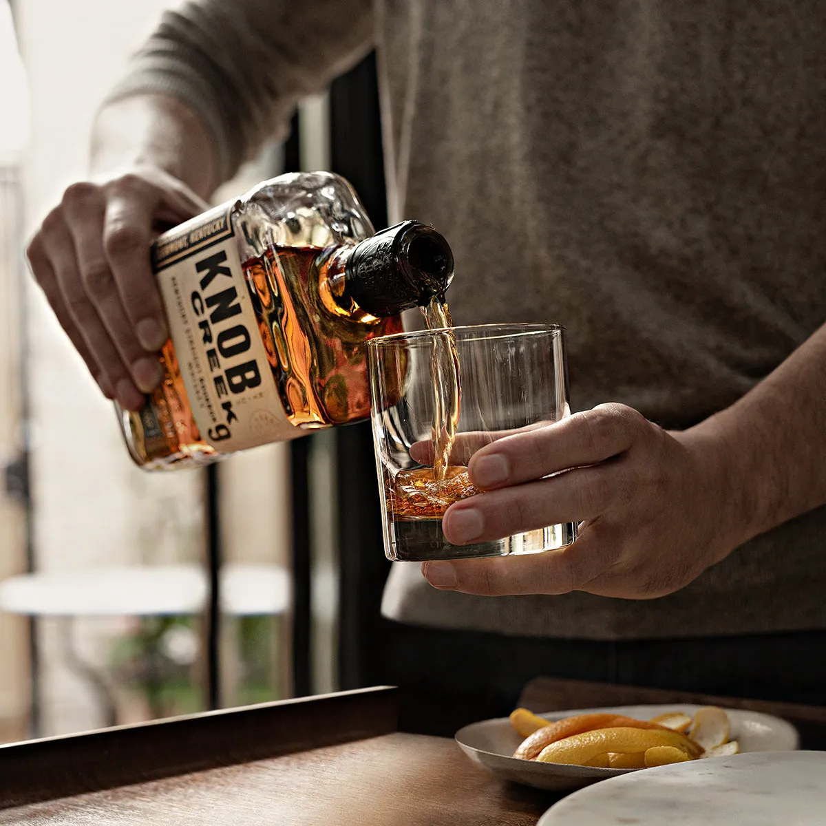 Man Pouring Whiskey Knob Creek
