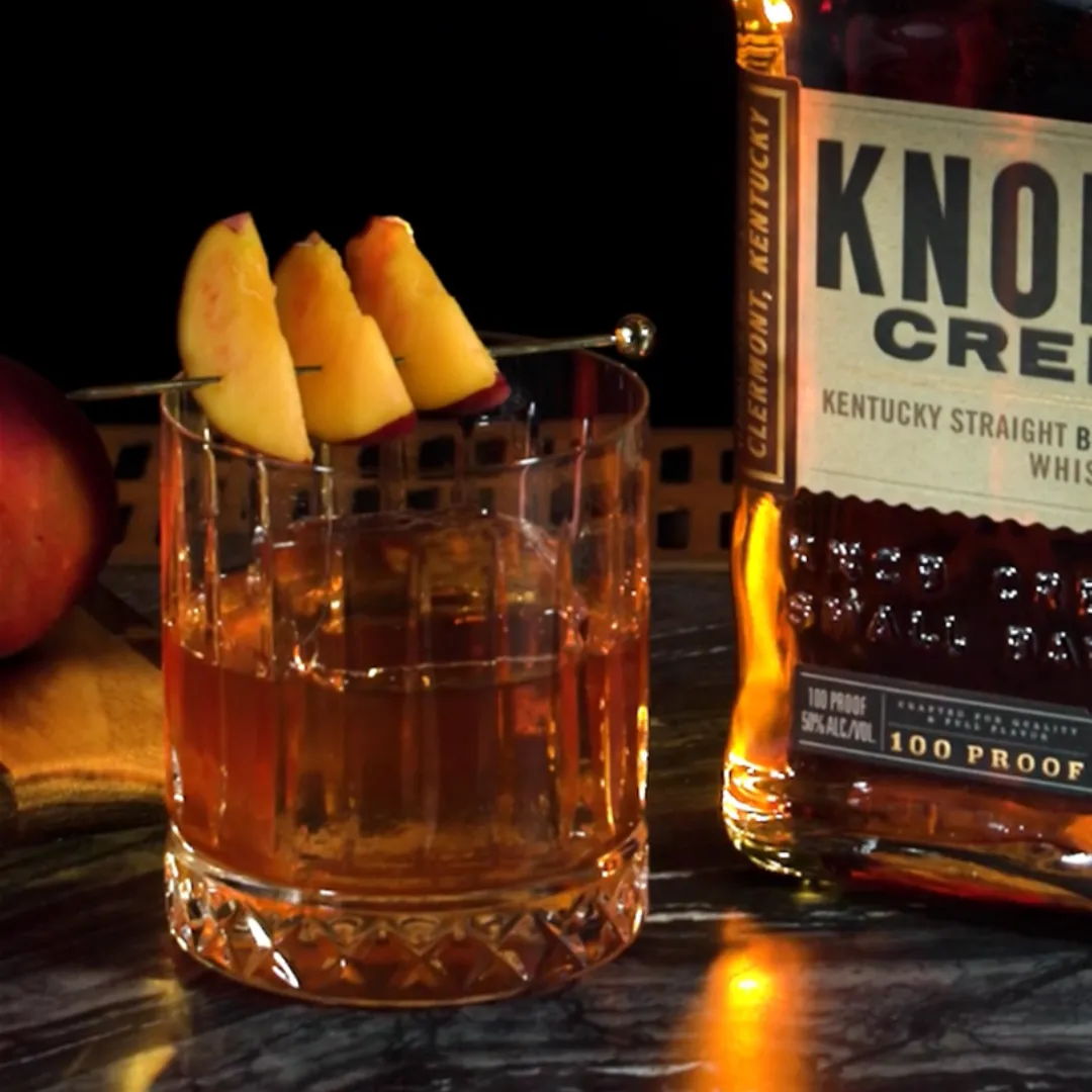 A glass of Peach Old Fashioned